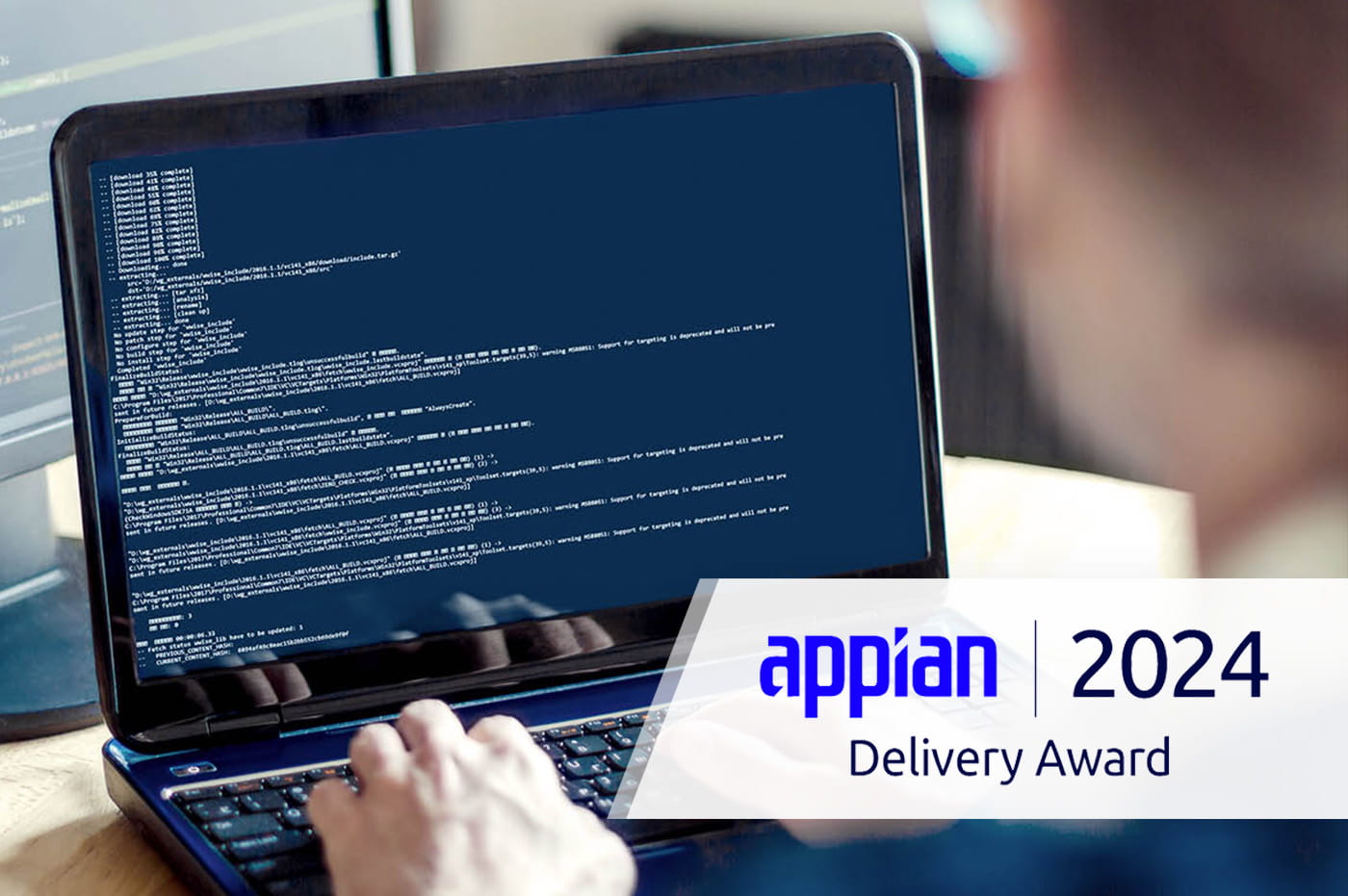 Appian 2024 Delivery Winner over image of person coding on a laptop.